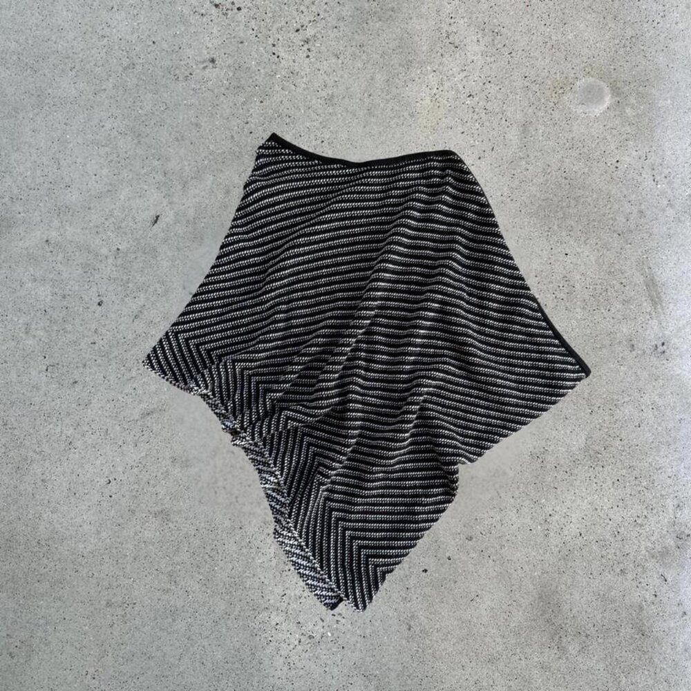 Black and white striped poncho